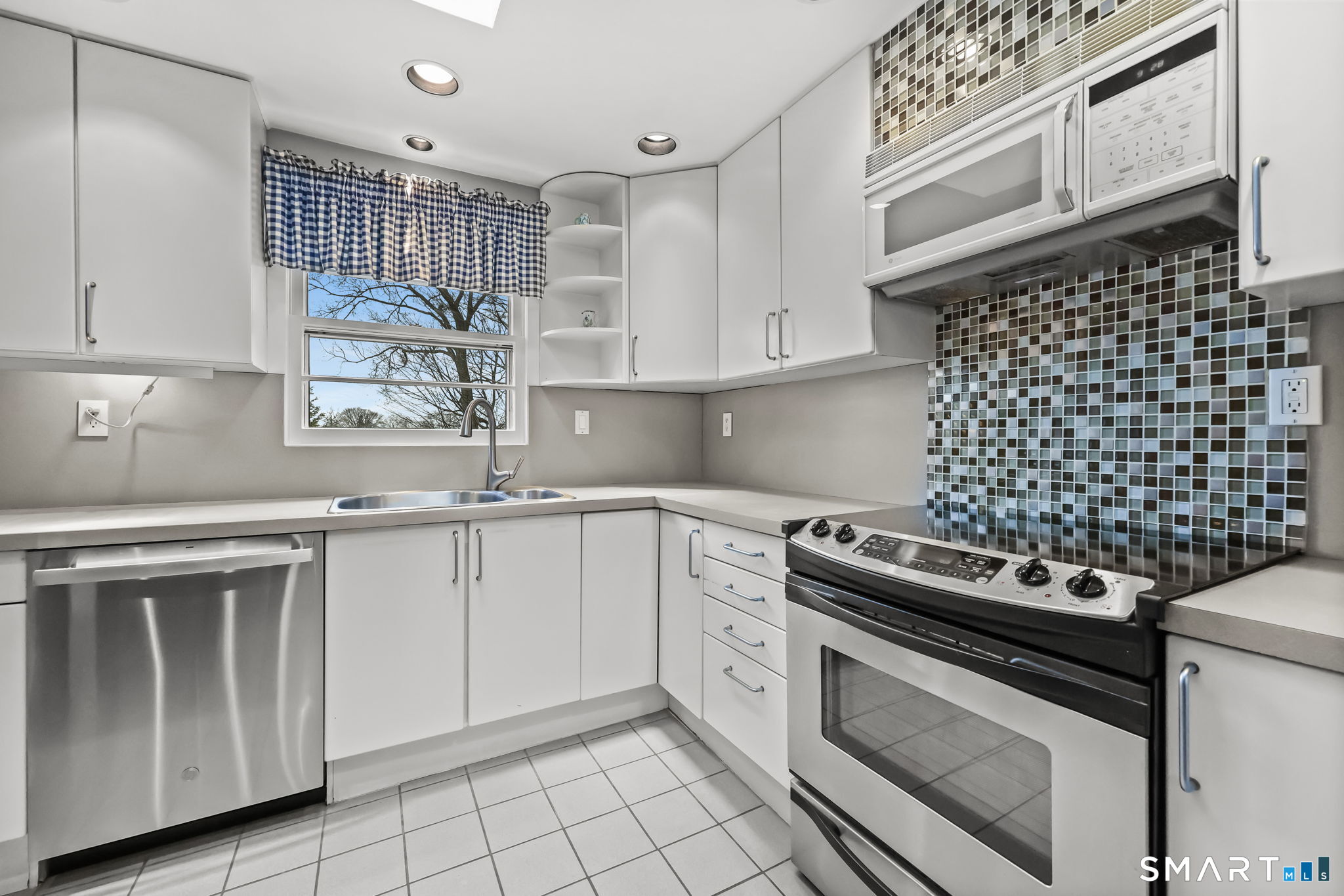 19 Lyncrest Drive Norwalk, CT 06851 - Photo 25 of 41 a kitchen with cabinets appliances and a sink