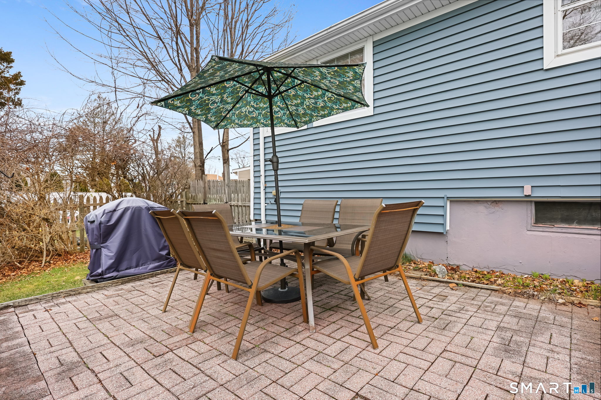 19 Lyncrest Drive Norwalk, CT 06851 - Photo 36 of 41 a patio with a table and chairs