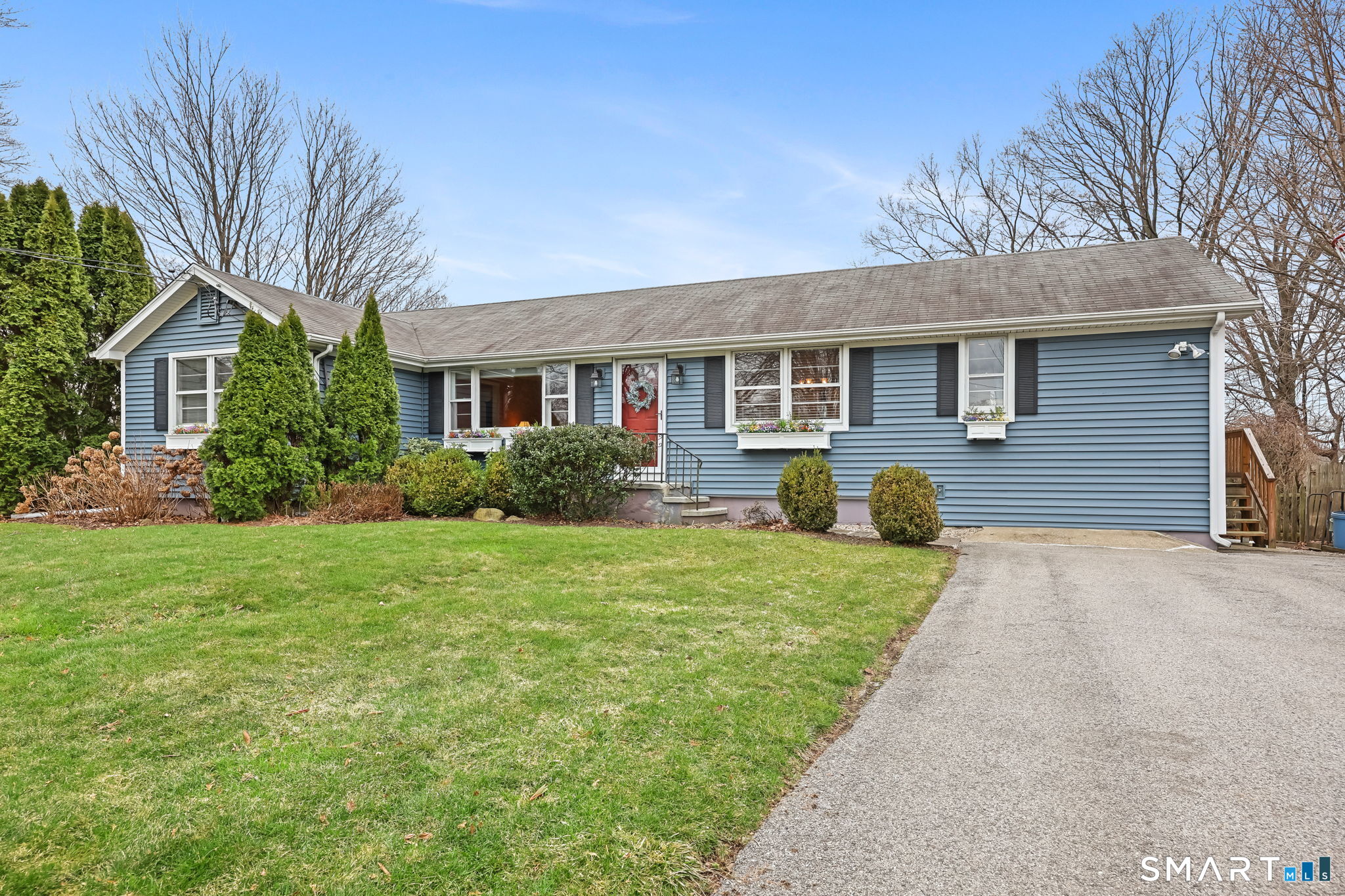 19 Lyncrest Drive Norwalk, CT 06851 - Photo 4 of 41 front view of a house with a yard