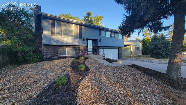 4648 Ridgeglen Road Colorado Springs, CO 80918 - Photo 2 of 19 Front View at Dusk