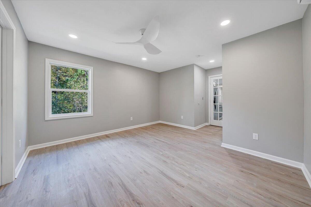8633 Grassy Hill Road Boones Mill, VA 24065 - Photo 17 of 33 an empty room with wooden floor and windows