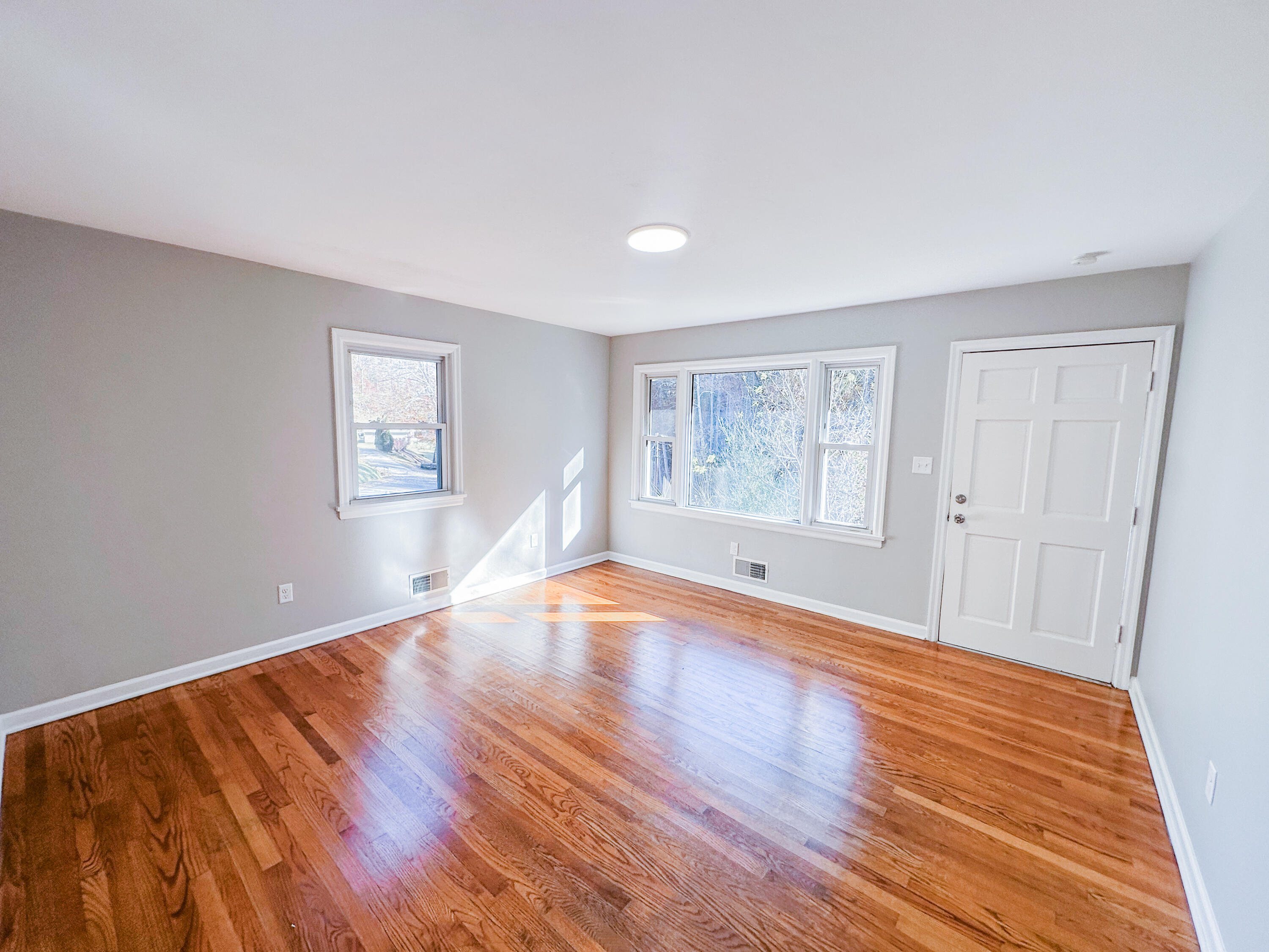 8633 Grassy Hill Road Boones Mill, VA 24065 - Photo 2 of 33 a view of empty room with wooden floor and fan