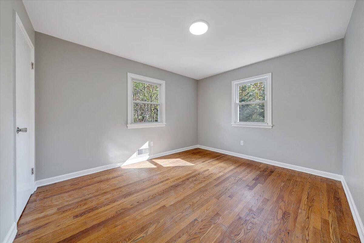 8633 Grassy Hill Road Boones Mill, VA 24065 - Photo 24 of 33 a view of empty room with wooden floor and fan