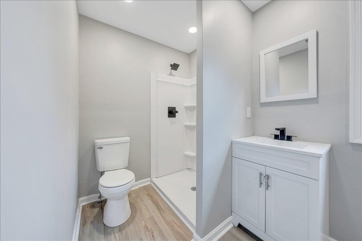 8633 Grassy Hill Road Boones Mill, VA 24065 - Photo 25 of 33 a bathroom with a sink a toilet and shower