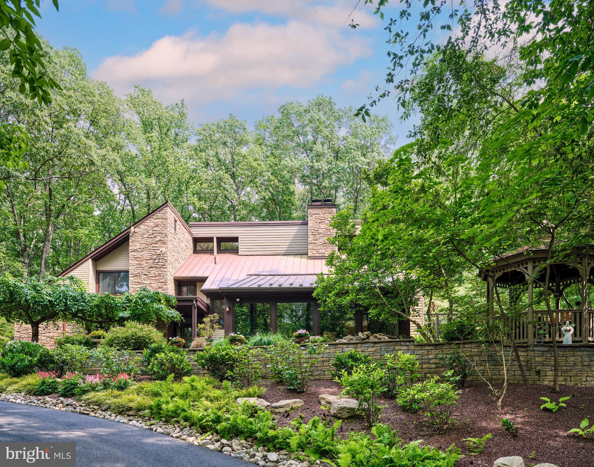 a view of a house with a yard and garden