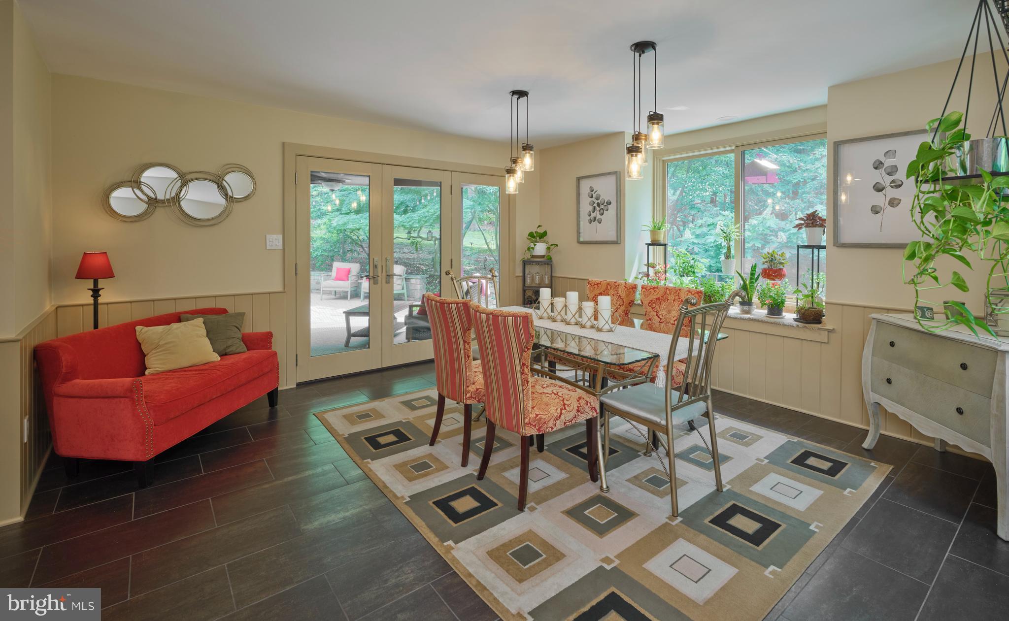 7028 Ely Road New Hope, PA 18938 - Photo 11 of 65 a dining room with furniture a chandelier and wooden floor