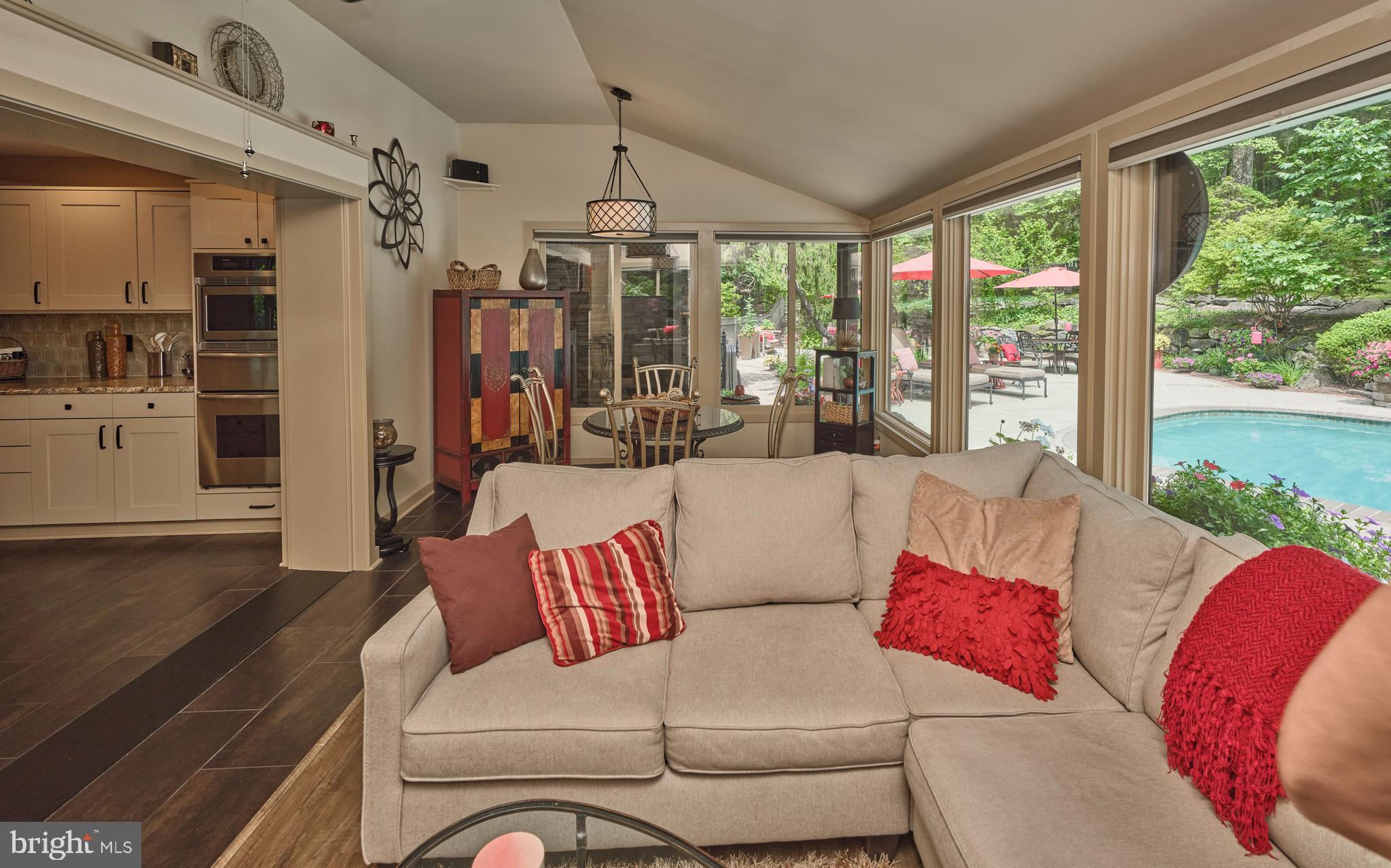 7028 Ely Road New Hope, PA 18938 - Photo 17 of 65 a living room with patio furniture and a floor to ceiling window