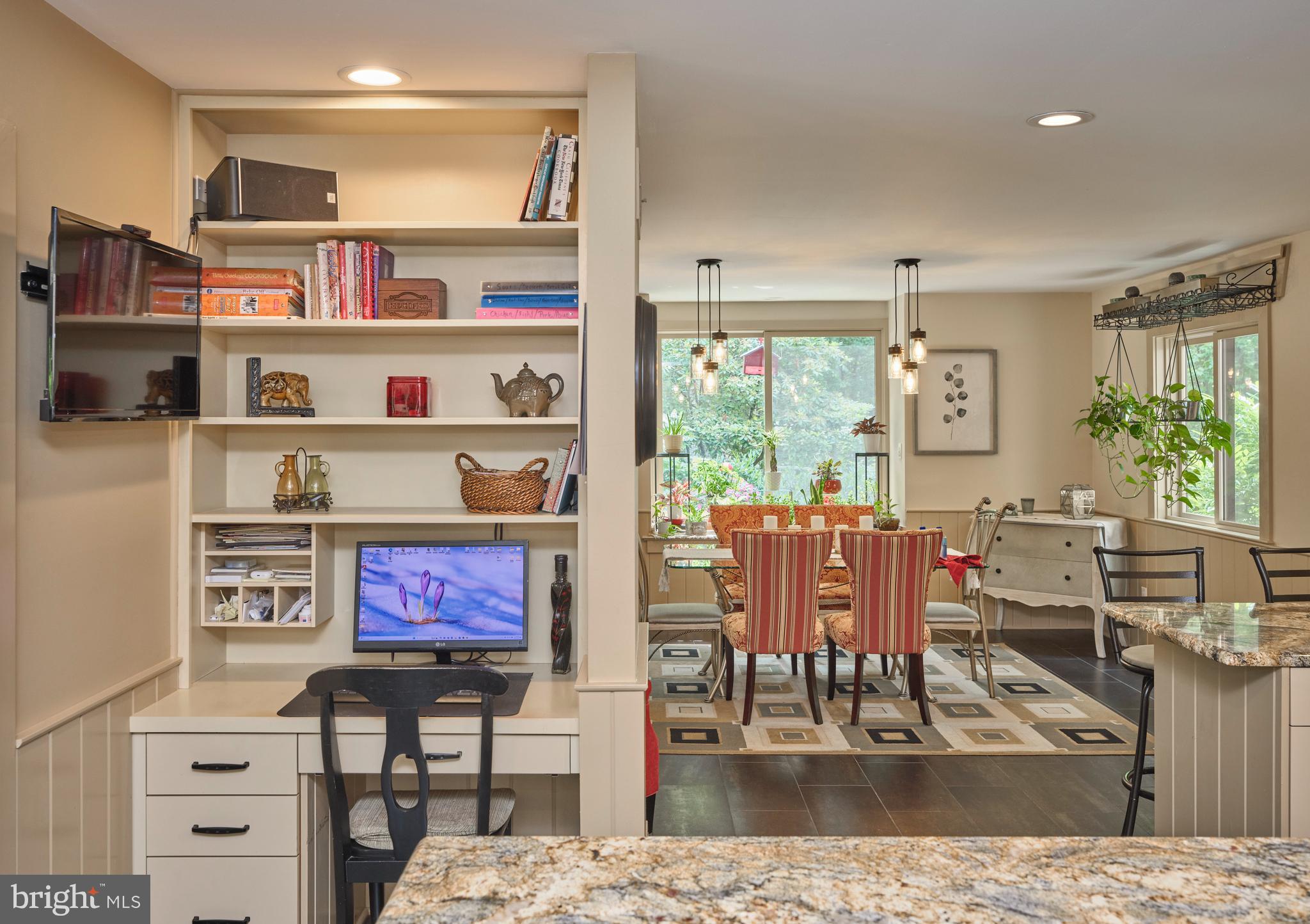 7028 Ely Road New Hope, PA 18938 - Photo 19 of 65 a living room with furniture a rug and a bookshelf