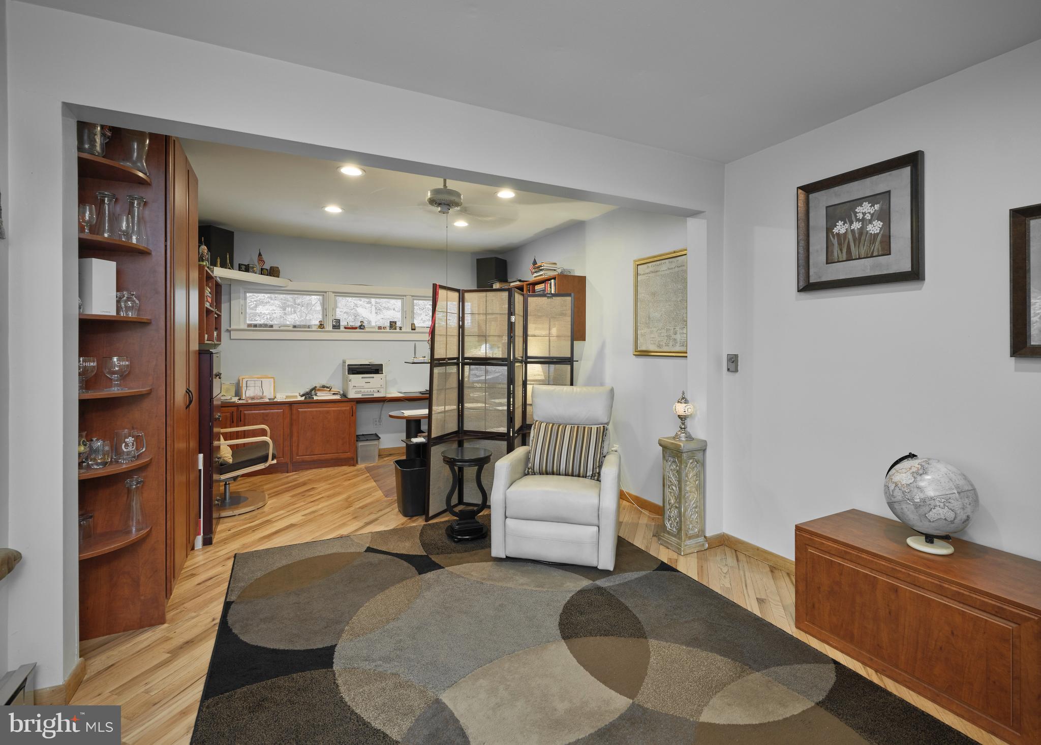 7028 Ely Road New Hope, PA 18938 - Photo 22 of 65 a living room with furniture and a wooden floor