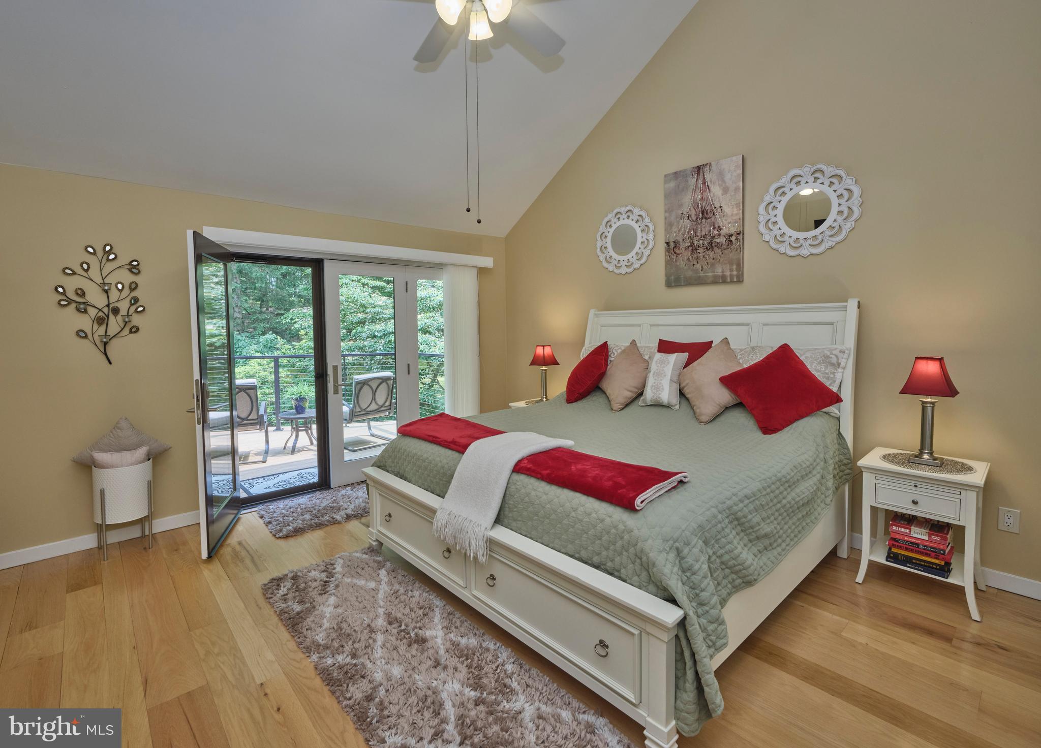 7028 Ely Road New Hope, PA 18938 - Photo 25 of 65 a bedroom with a bed and a large window
