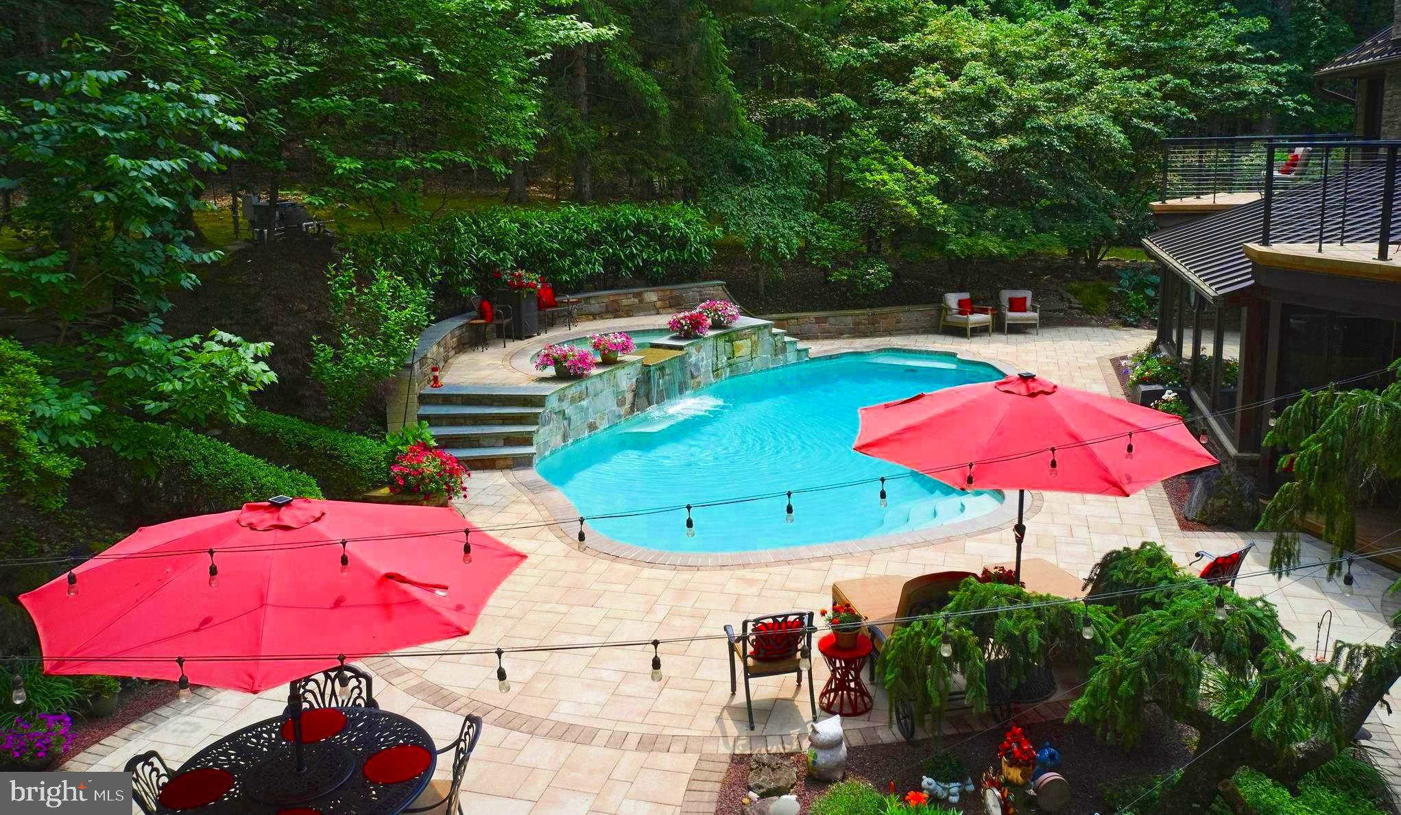 7028 Ely Road New Hope, PA 18938 - Photo 3 of 65 an outdoor space with furniture and umbrella