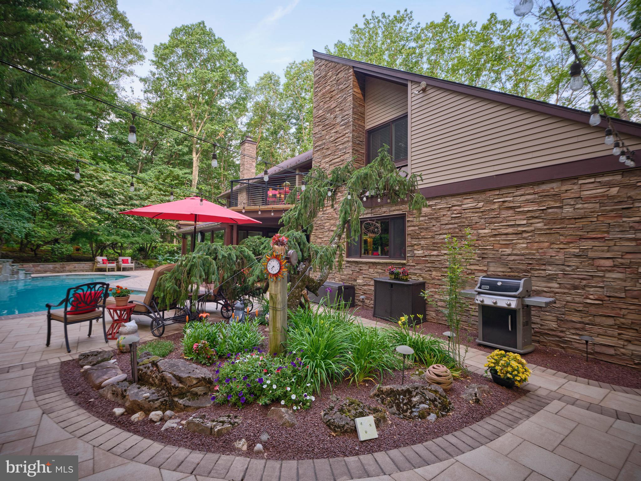 7028 Ely Road New Hope, PA 18938 - Photo 46 of 65 a view of a porch with furniture and a garden