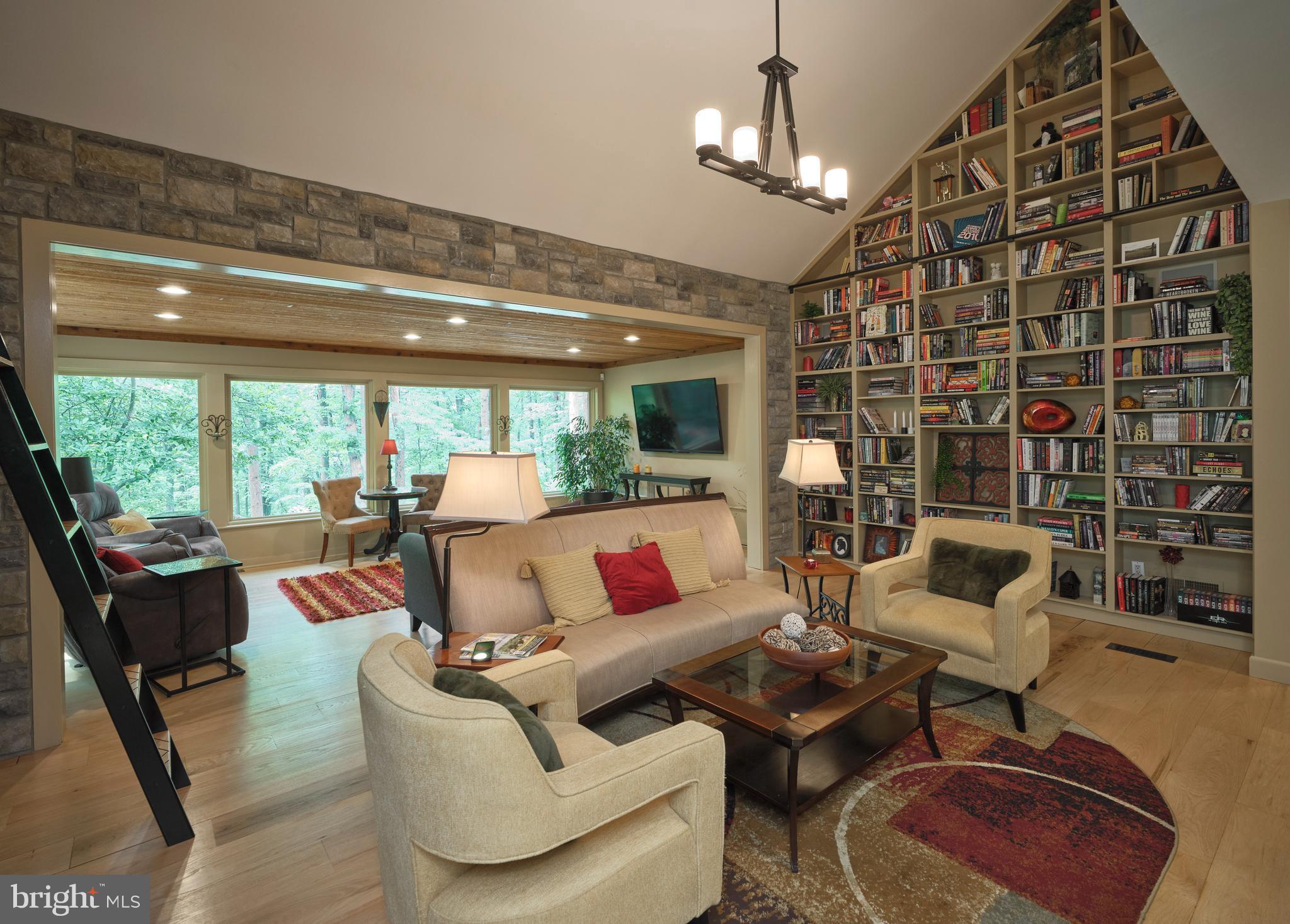7028 Ely Road New Hope, PA 18938 - Photo 7 of 65 a living room with furniture and a chandelier