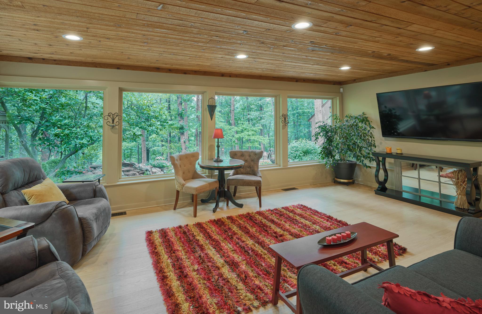 7028 Ely Road New Hope, PA 18938 - Photo 8 of 65 a living room with furniture and a flat screen tv