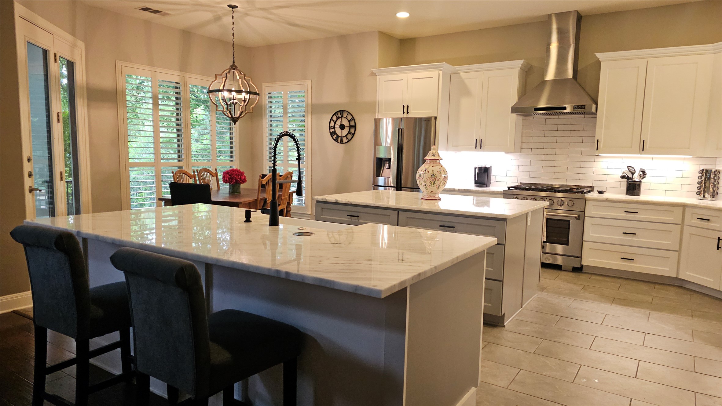 15508 Spillman Ranch Loop Bee Cave, TX 78738 - Photo 3 of 5 The eat-in kitchen features two islands, stainless steel appliances, and marble countertops.