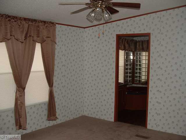 1101 Hill Road King, NC 27021 - Photo 9 of 10 Master Bedroom. Master Suite with NEW Blinds, Curtains and Carpet.
