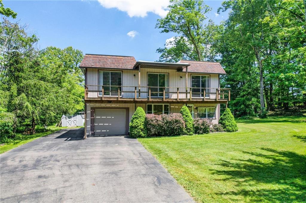 234 Sky Top Road Acme, PA 15610 - Photo 1 of 19 a front view of a house with garden