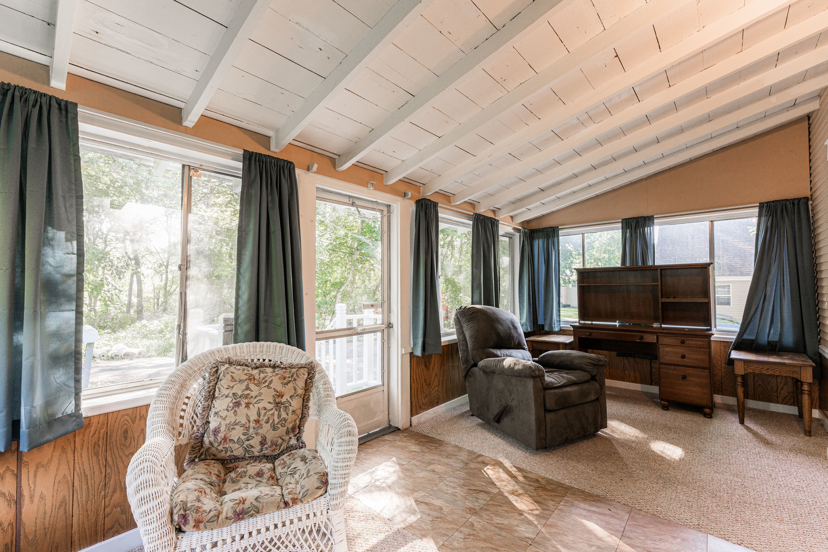 8415 Balder Drive Cary, IL 60013 - Photo 12 of 34 a living room with furniture a flat screen tv and floor to ceiling window