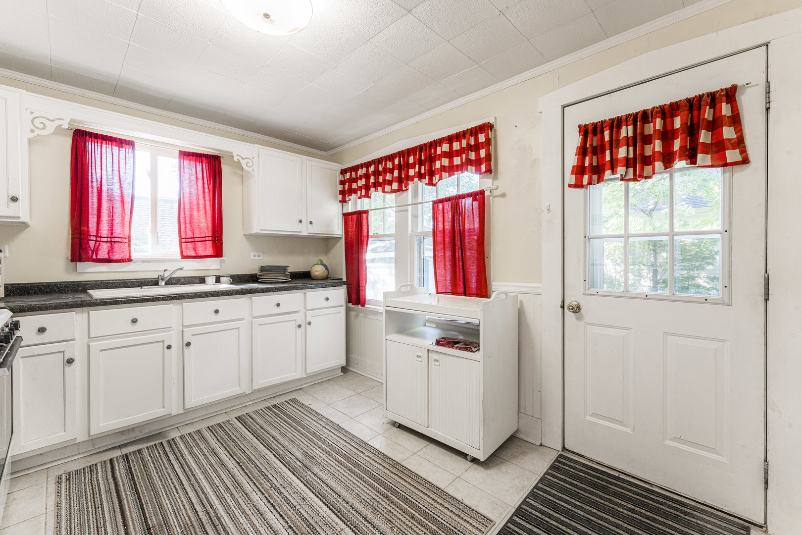 8415 Balder Drive Cary, IL 60013 - Photo 20 of 34 a kitchen with a refrigerator wooden floor and window
