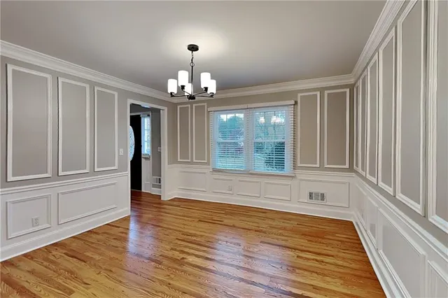 a view of livingroom with kitchen and hardwood