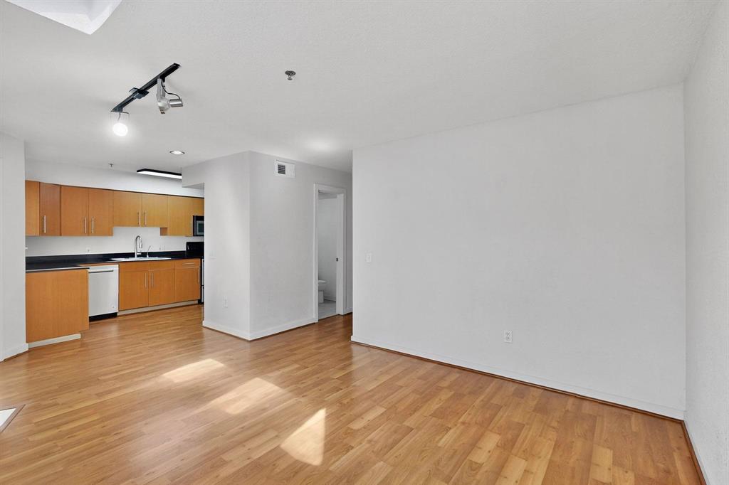 3901 Travis Street, Unit 113 Dallas, TX 75204 - Photo 17 of 40 a view of kitchen with wooden floor