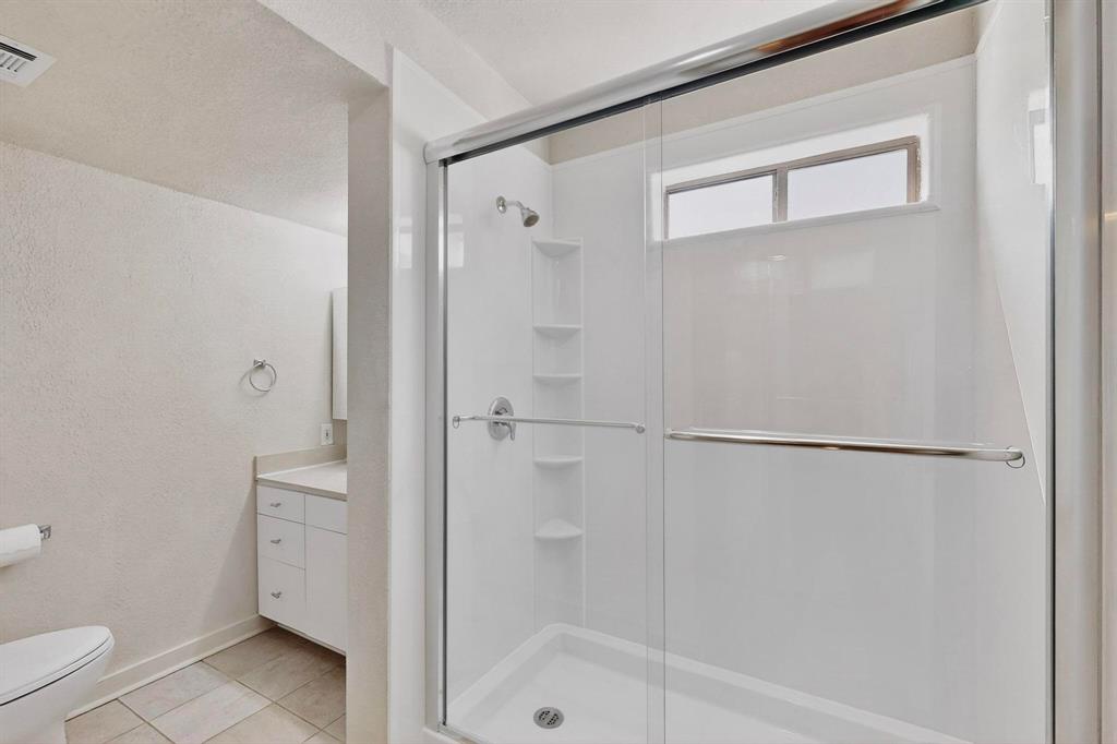 3901 Travis Street, Unit 113 Dallas, TX 75204 - Photo 28 of 40 a bathroom with a shower