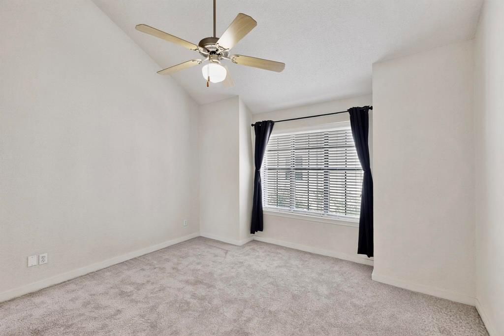 3901 Travis Street, Unit 113 Dallas, TX 75204 - Photo 30 of 40 an empty room with windows and fan