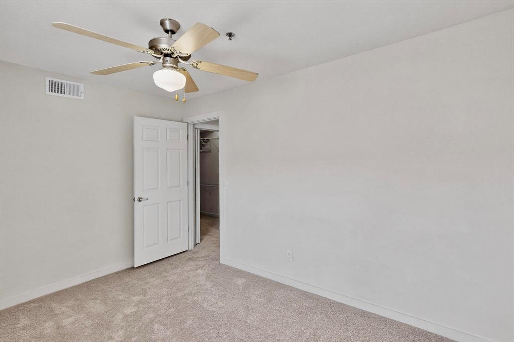 3901 Travis Street, Unit 113 Dallas, TX 75204 - Photo 31 of 40 a view of a chandelier fan in a room