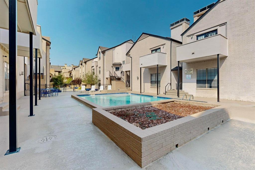 3901 Travis Street, Unit 113 Dallas, TX 75204 - Photo 9 of 40 a swimming pool with a outdoor seating and yard