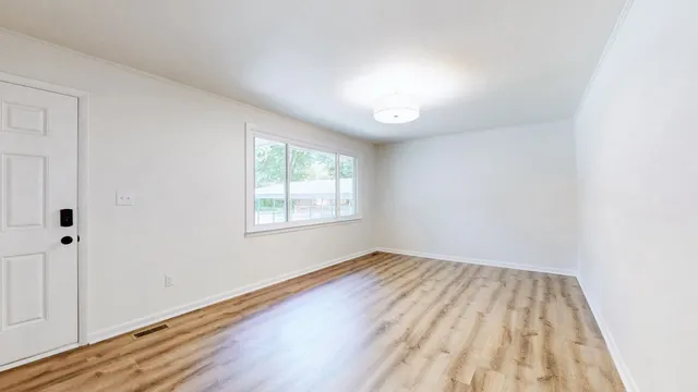 a view of a storage & utility room with wooden floor