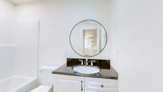 a view of a house with pool and trees in the background