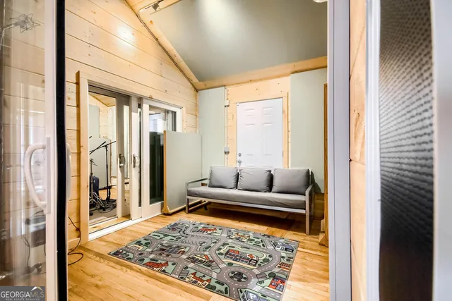 a living room with rug furniture and a rug