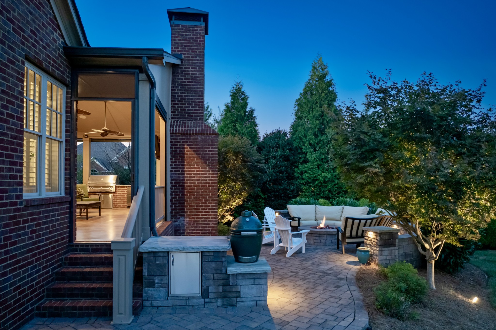 1828 Kettering Trace Brentwood, TN 37027 - Photo 47 of 62 a view of a patio with table and chairs and potted plants with wooden floor and wall