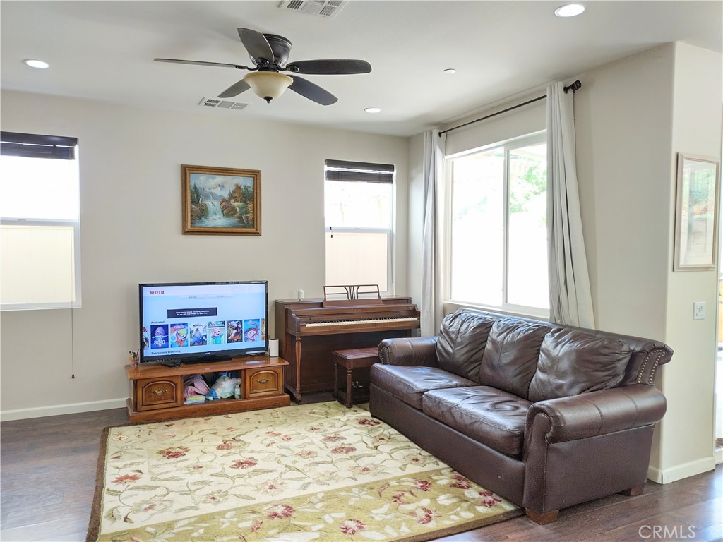 11811 Cramer Road Yucaipa, CA 92399 - Photo 14 of 56 a living room with furniture and a flat screen tv