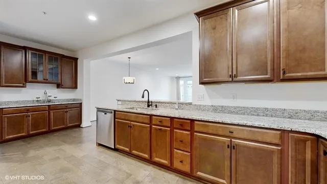 a view of a livingroom with furniture and a potted plant