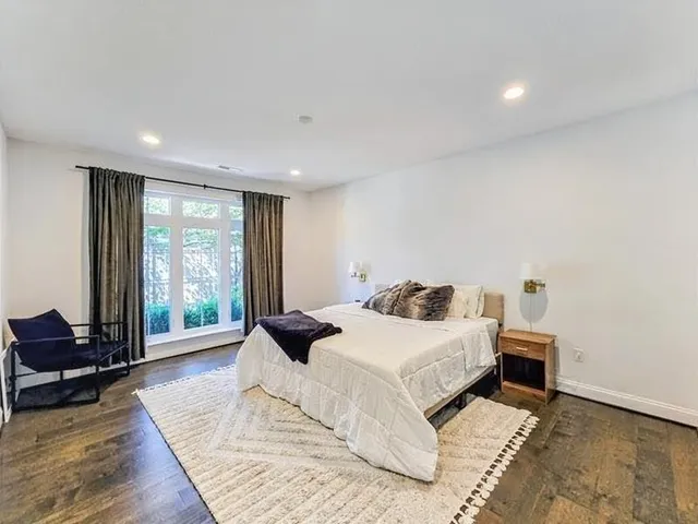 a backyard of a house with table and chairs