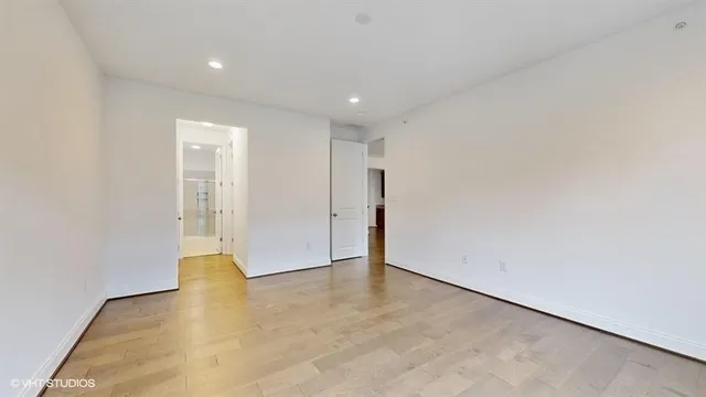 a front view of a brick building with large windows