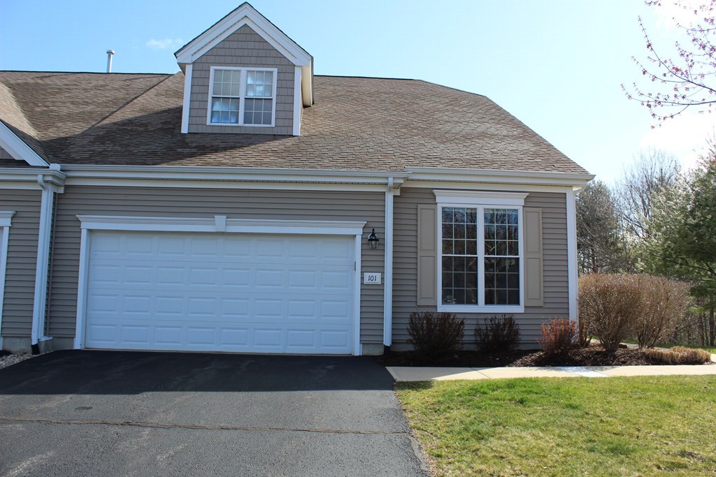 101 Buttercup Lane, Unit 101 Grafton, MA 01560 - Photo 1 of 24 a front view of a house with a yard