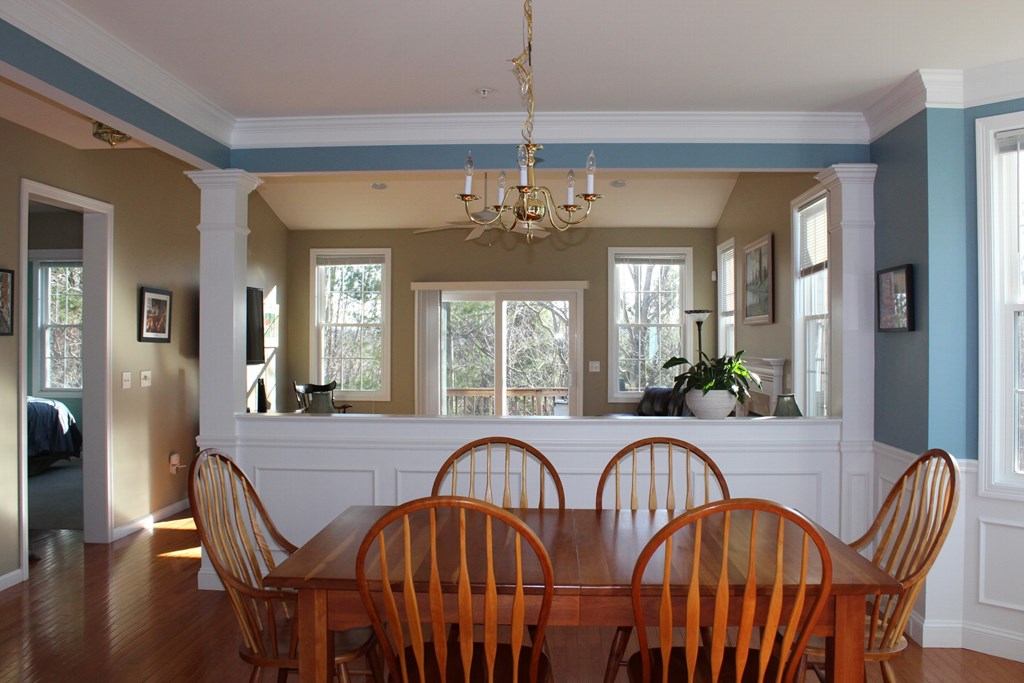 101 Buttercup Lane, Unit 101 Grafton, MA 01560 - Photo 4 of 24 a view of a a dining room with furniture window and wooden floor