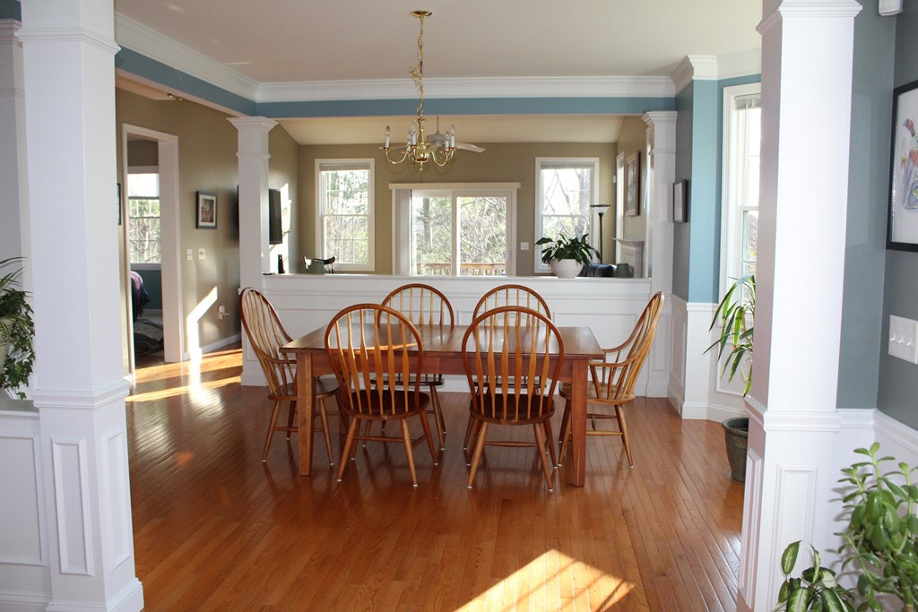 101 Buttercup Lane, Unit 101 Grafton, MA 01560 - Photo 5 of 24 a view of a dining room with furniture window and wooden floor