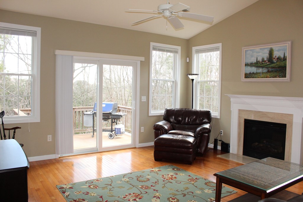 101 Buttercup Lane, Unit 101 Grafton, MA 01560 - Photo 10 of 24 a living room with furniture and a fireplace