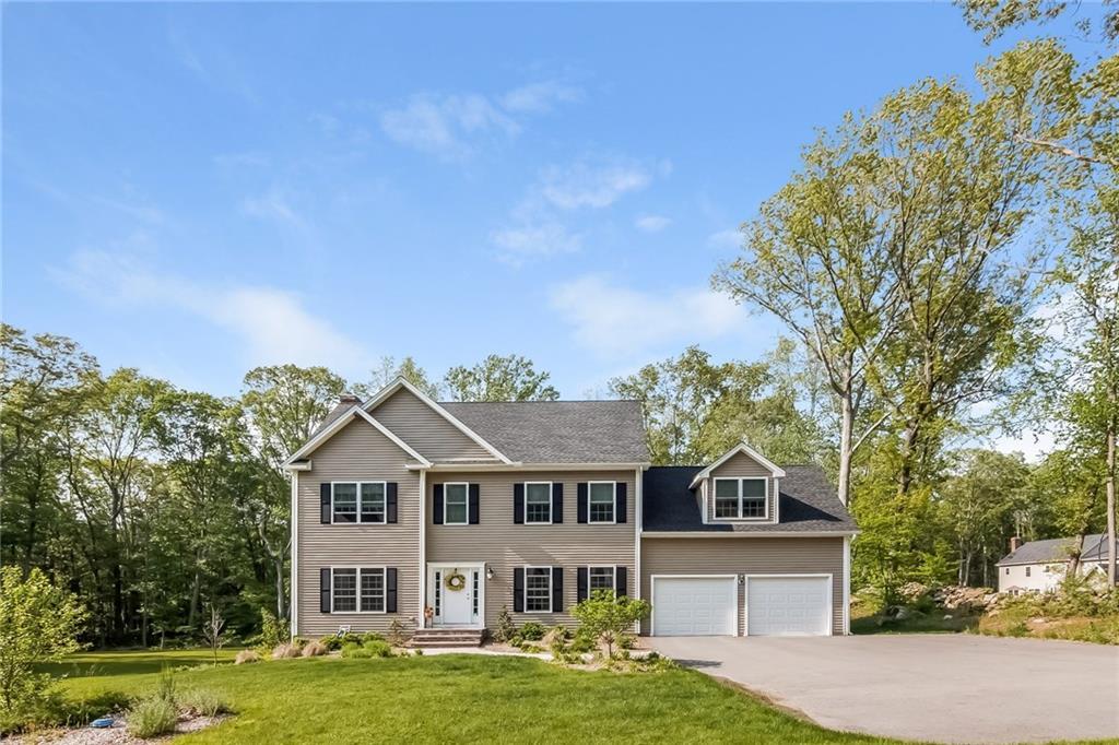 283 Warpas Road Madison, CT 06443 - Photo 1 of 1 front view of a house with a garden