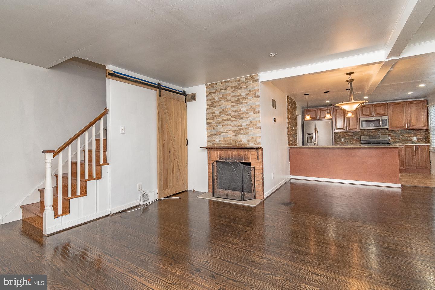 10168 Verree Road Philadelphia, PA 19116 - Photo 9 of 35 a view of a livingroom with wooden floor and a kitchen