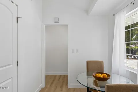 a view of dining room with furniture and wooden floor