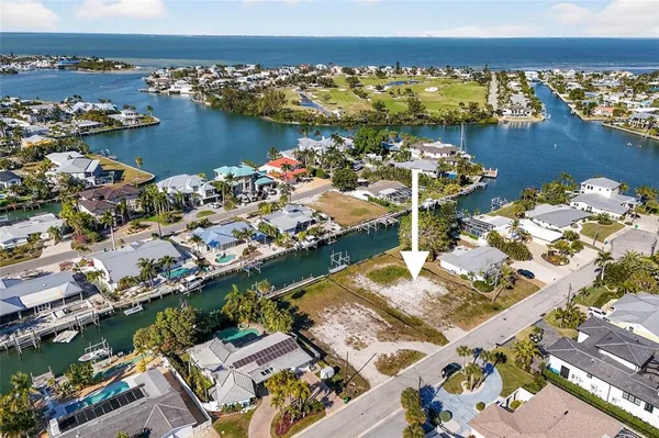 an aerial view of a house with a ocean view