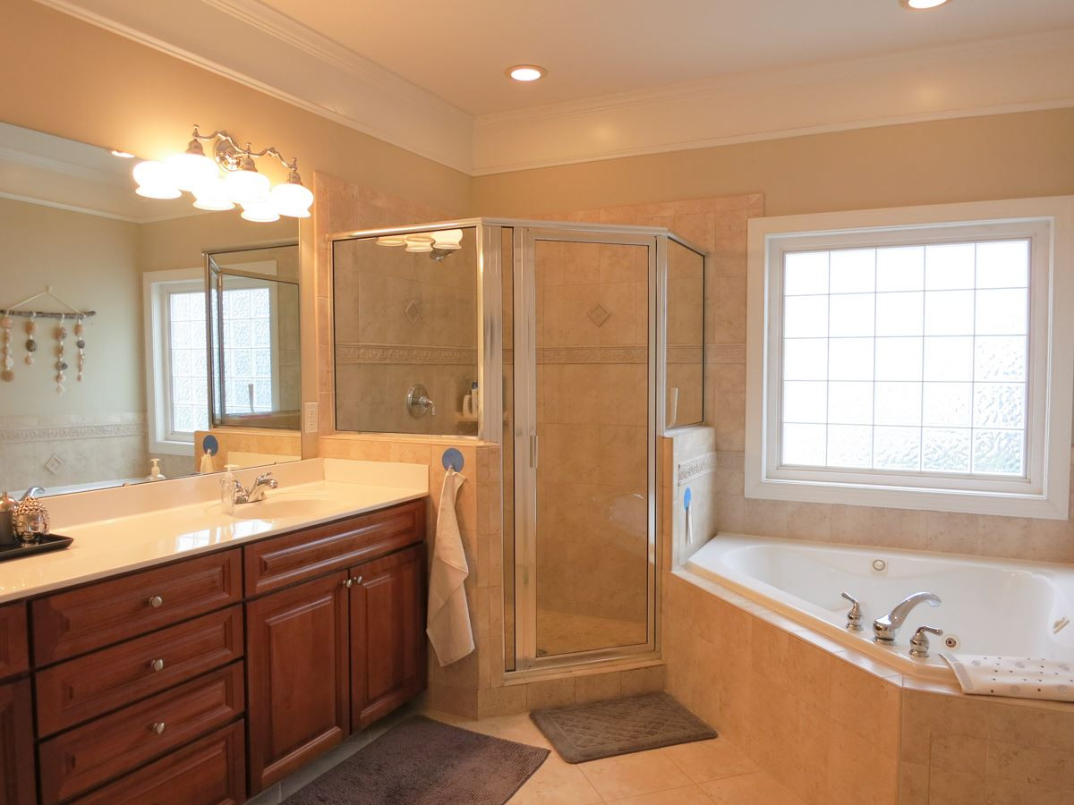 3205 Canes Way Raleigh, NC 27614 - Photo 13 of 25 Spa-like Master Bath features a corner jetted tub, lg tiled shower, long vanity w/double sinks, tile floor & private toilet rm. Master Bath/Spa