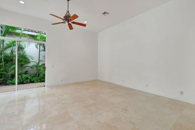 a view of kitchen with stainless steel appliances granite countertop cabinets and outdoor view