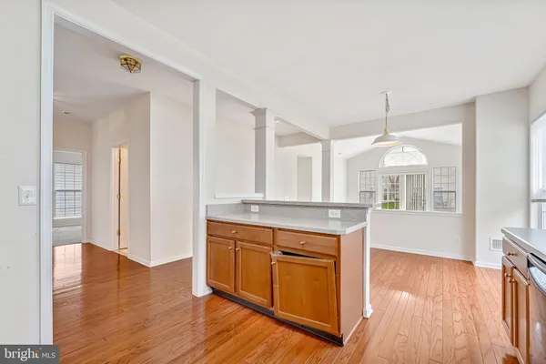 a view of a kitchen cabinets and wooden floor