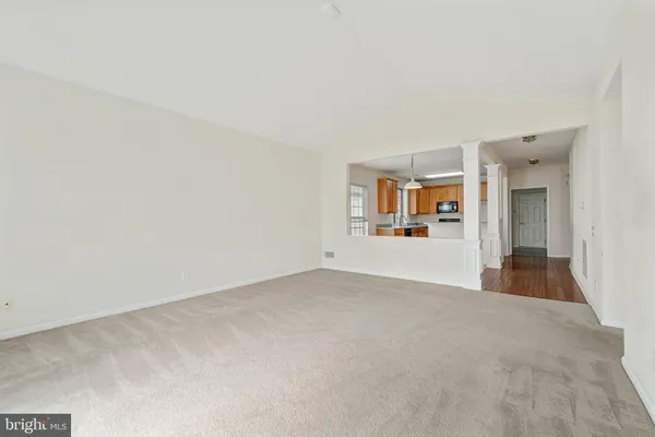 an empty room with windows and entrance