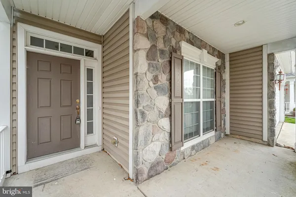a view of front door and yard